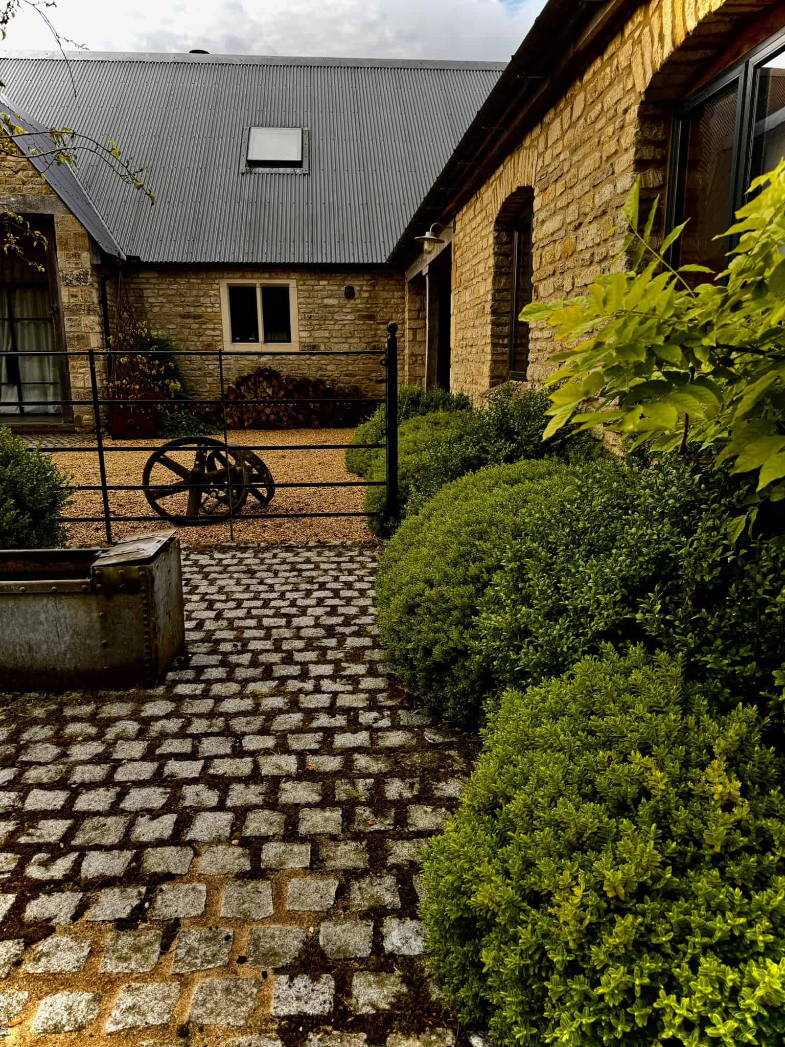 cotswold courtyard cobble entrance buxus balls